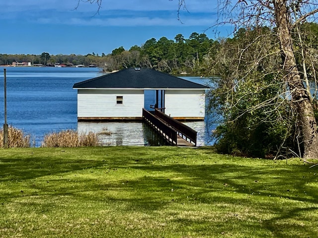 dock area featuring a water view and a yard