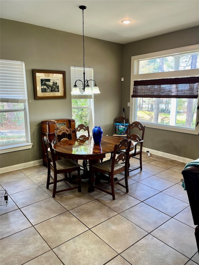 dining area featuring a healthy amount of sunlight and light tile flooring