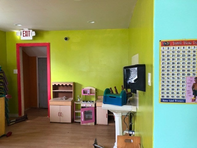 recreation room featuring hardwood / wood-style flooring