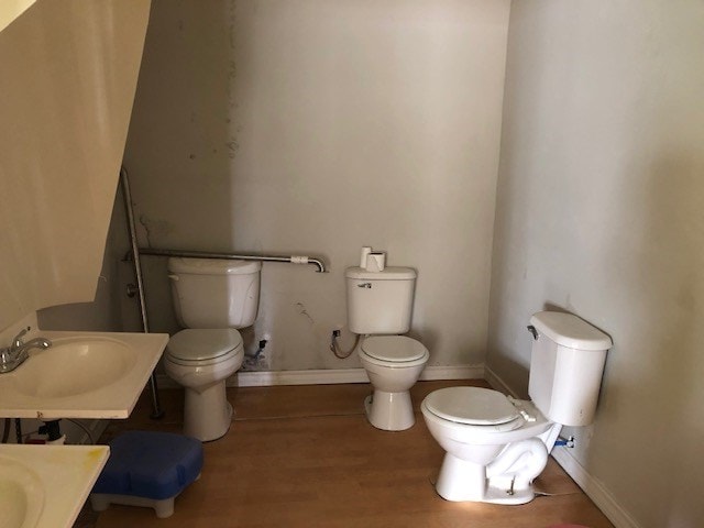 bathroom with vanity, hardwood / wood-style floors, and toilet