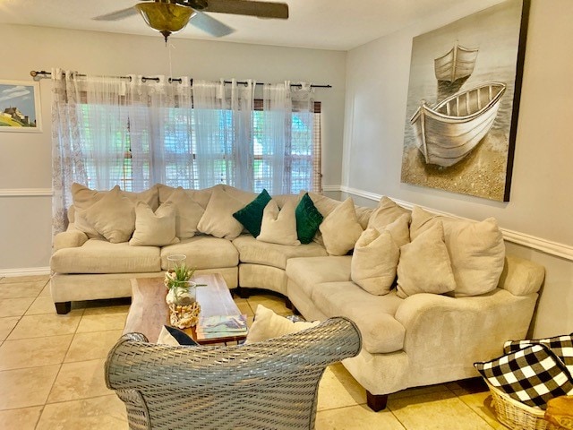 living room featuring light tile flooring, plenty of natural light, and ceiling fan