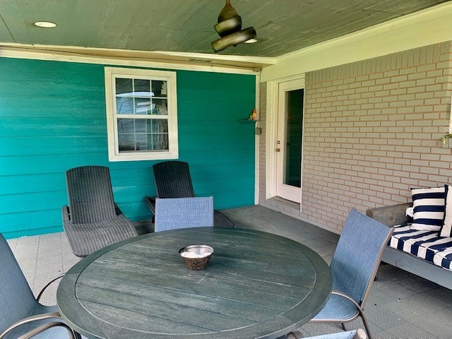 view of patio featuring ceiling fan