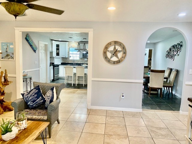 interior space with ceiling fan and sink