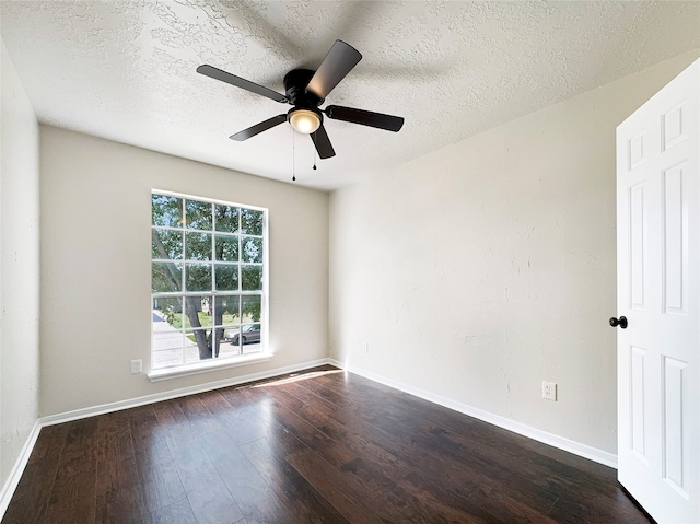 unfurnished room featuring dark hardwood / wood-style floors, a textured ceiling, and ceiling fan