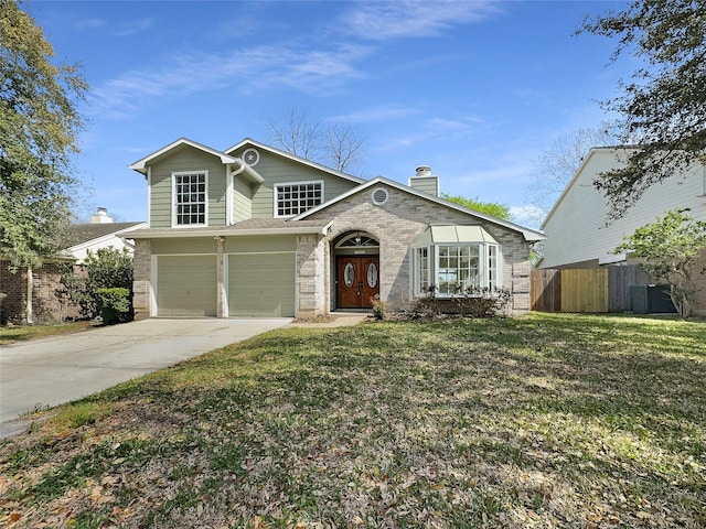 view of front of home featuring a front yard and a garage