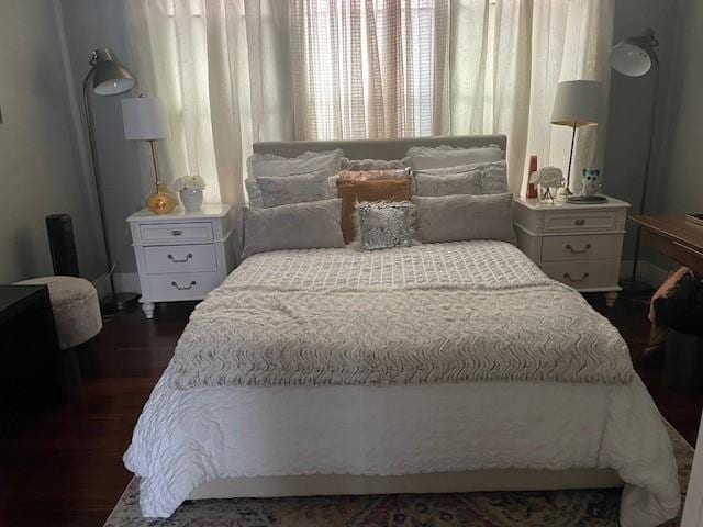 bedroom featuring dark wood-type flooring