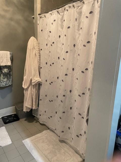 bathroom featuring tile patterned floors and a shower with curtain