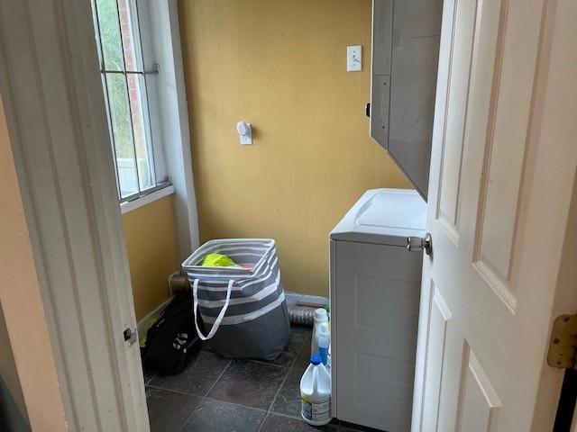 washroom with washer / dryer