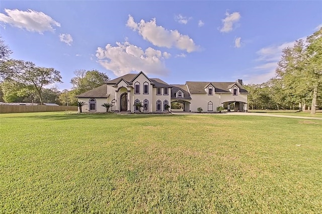 back of house with a yard