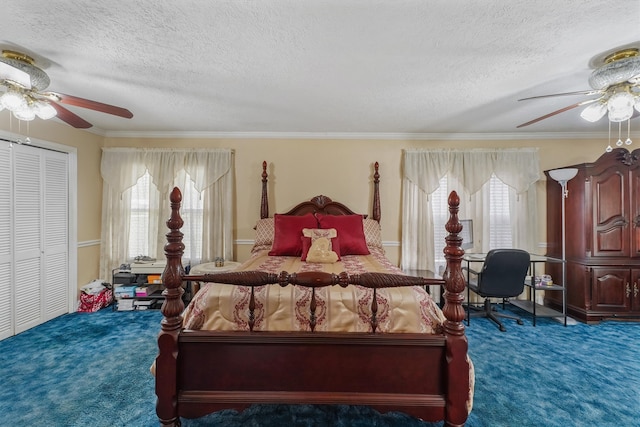 bedroom featuring carpet flooring, ceiling fan, a closet, and a textured ceiling