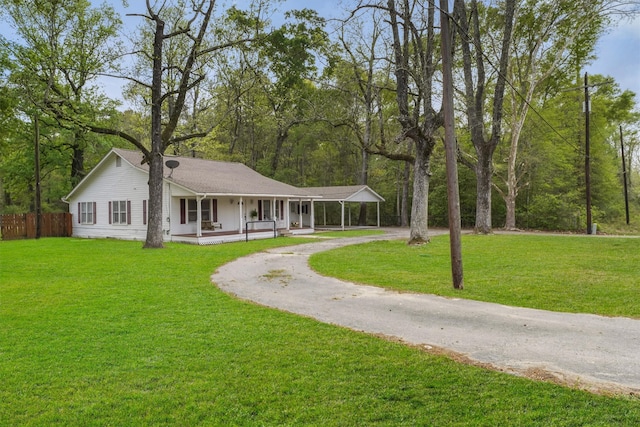 exterior space with a porch and a front yard