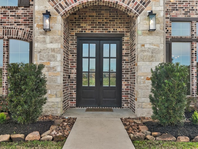 view of exterior entry featuring french doors