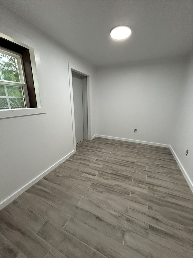 empty room with wood-type flooring