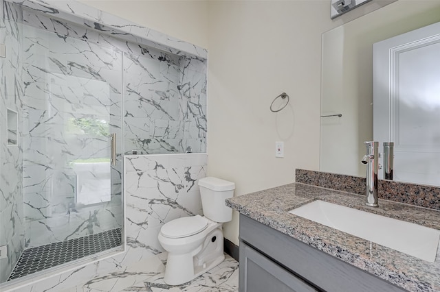 full bathroom featuring toilet, marble finish floor, a marble finish shower, and vanity