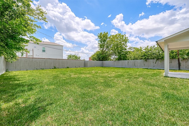 view of yard with a fenced backyard