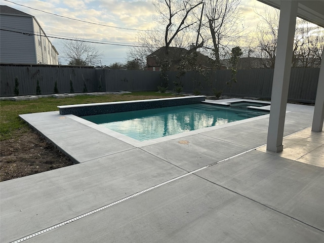 view of pool featuring a fenced backyard, a fenced in pool, and a patio