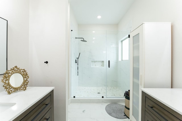 bathroom with tile flooring, vanity, and a shower with shower door