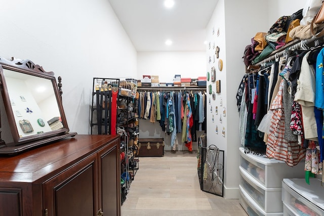 spacious closet featuring light wood-type flooring