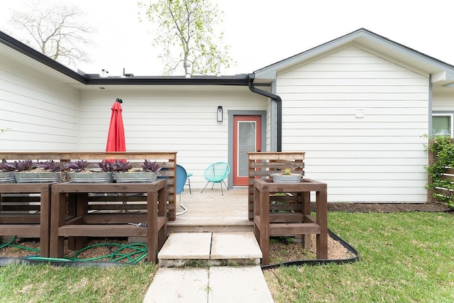 wooden deck featuring a yard