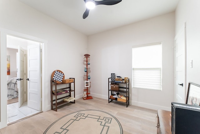 misc room featuring ceiling fan and light wood-type flooring