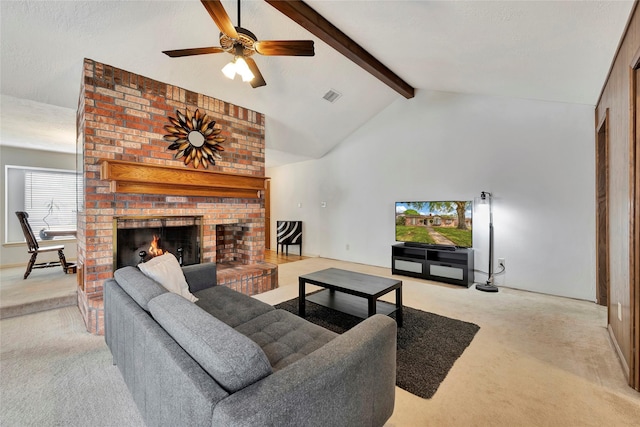 living room featuring high vaulted ceiling, a fireplace, beamed ceiling, light colored carpet, and ceiling fan