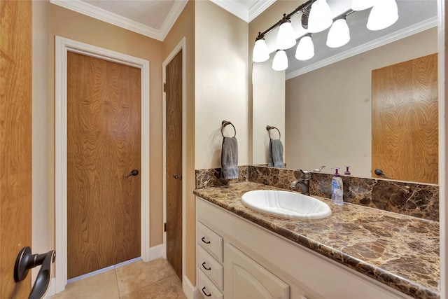 bathroom featuring vanity, tile patterned floors, and ornamental molding