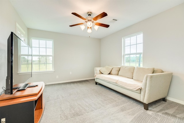 living room with carpet and ceiling fan