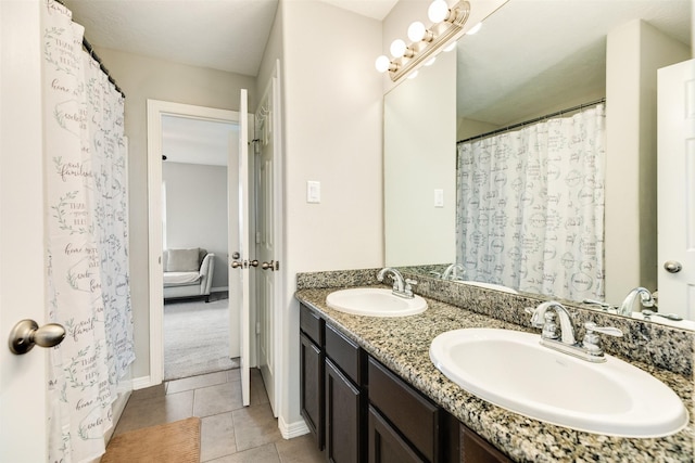 bathroom featuring tile patterned flooring and vanity