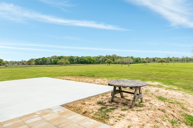 view of home's community with a lawn and a rural view