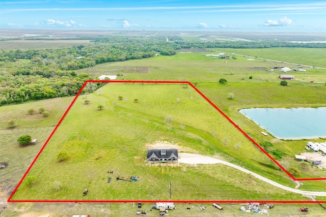 aerial view with a rural view and a water view