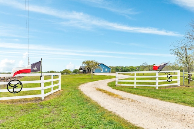 view of gate featuring a yard