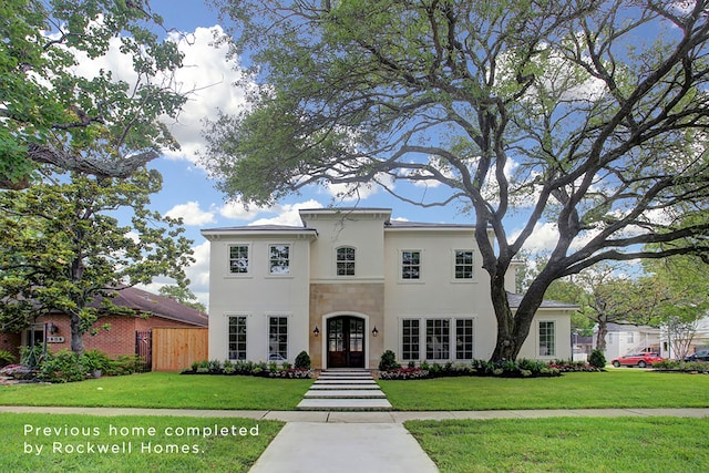 view of front facade with french doors and a front yard