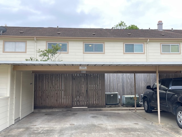 exterior space with a carport and central AC unit