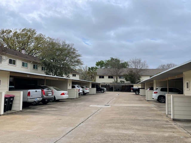 view of vehicle parking featuring a carport