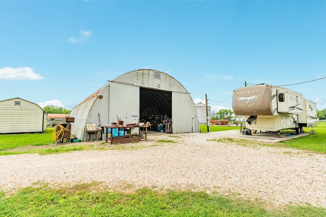 view of shed / structure featuring a yard