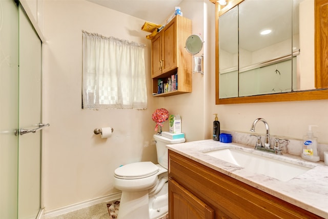 bathroom with large vanity and toilet