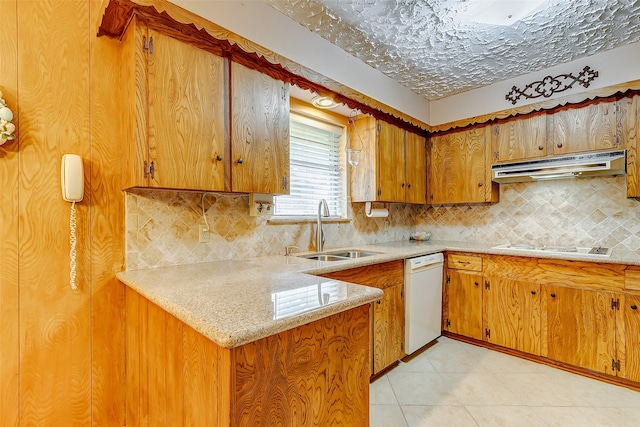 kitchen featuring kitchen peninsula, tasteful backsplash, white appliances, sink, and light tile patterned floors