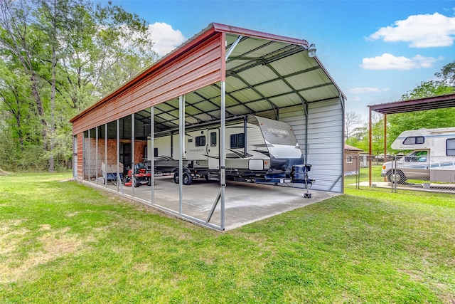 view of vehicle parking with a yard and a carport