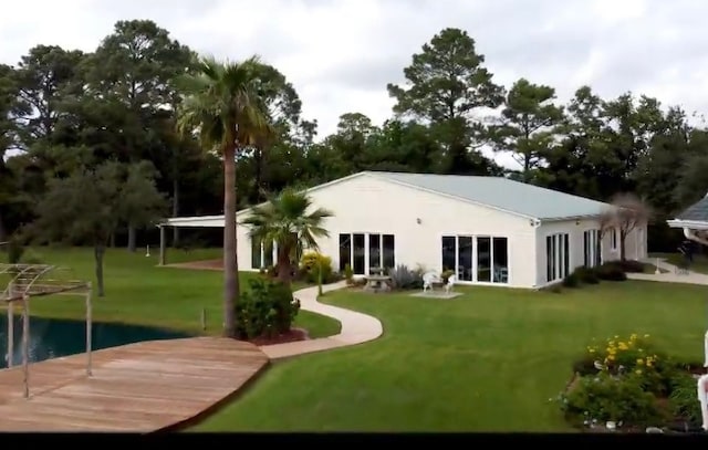 rear view of house with a lawn