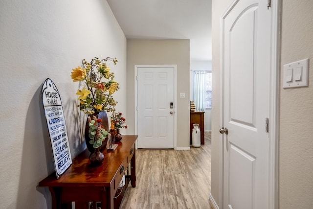 hallway featuring light hardwood / wood-style flooring