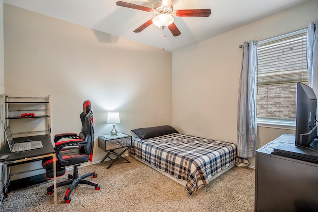 bedroom featuring ceiling fan and carpet