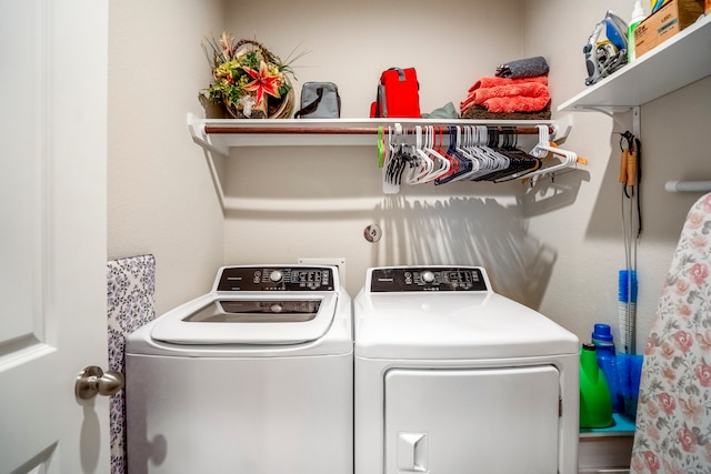 laundry area featuring washing machine and clothes dryer