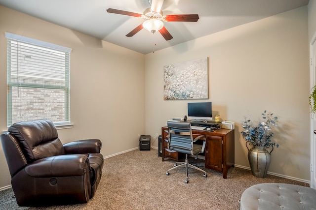 office featuring a wealth of natural light, light carpet, and ceiling fan