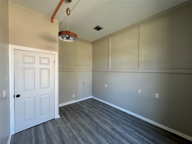 unfurnished room with dark hardwood / wood-style floors