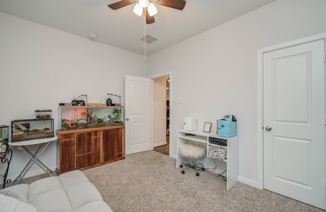 office area with light colored carpet and ceiling fan