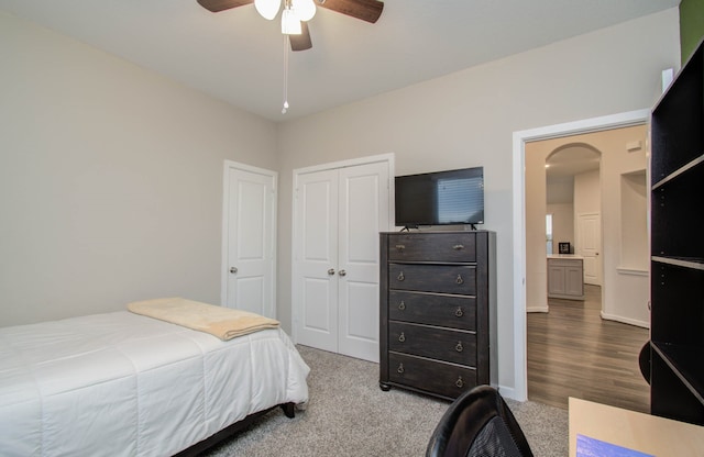 bedroom featuring a closet, ceiling fan, and light hardwood / wood-style flooring