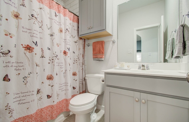 bathroom featuring oversized vanity, toilet, and tile floors