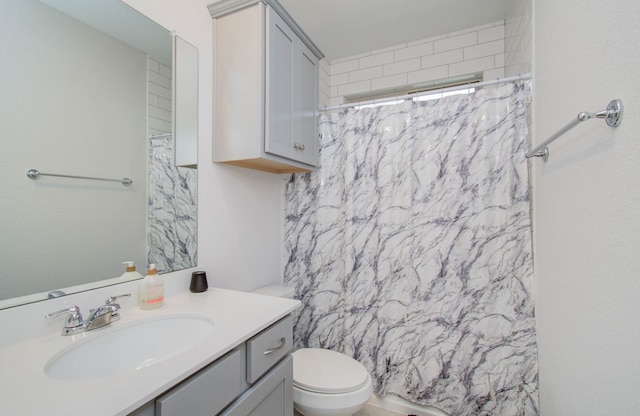 bathroom with toilet and vanity