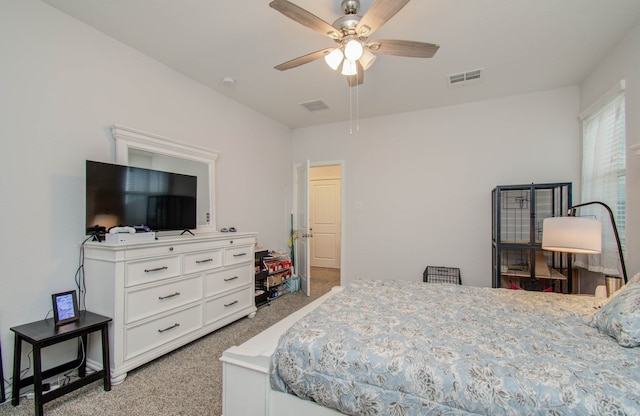 bedroom featuring light colored carpet and ceiling fan