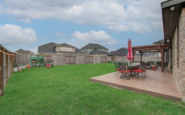 view of yard with a patio area and a pergola